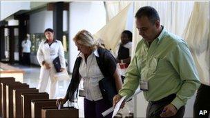 Delegates cast their votes during the Congress of the Cuban Communist Party session in Havana