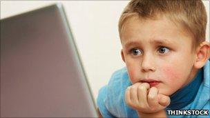Boy looking at laptop