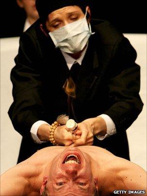 Two actors performing on stage