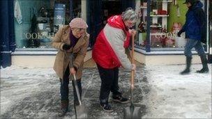 Shopkeepers clear snow