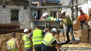 Fire Service rescue man with are impaled by metal bar