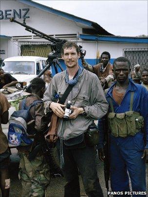 Tim Hetherington among rebel fighters of Liberians United for Reconciliation and Democracy (LURD) at their frontline headquarters in Tubmanberg, 2003