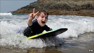 Sam Davies plays in the sea at Whitesands in Pembrokeshire in Wales