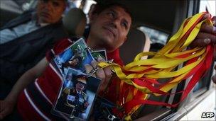 Merchandise featuring Colonel Gaddafi is on sale in Tripoli on 20/4/11