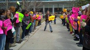 Students holding political signs