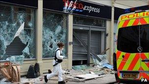 Front of Tesco store with smashed windows