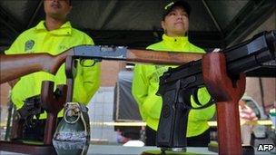 Weapons, seized from criminal gangs, are displayed at a square in Medellin, Antioquia Department, Colombia on March 18, 2011