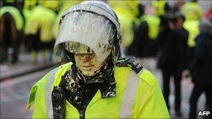 A policeman covered in paint at the demonstration on 9 December