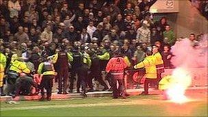 Flare thrown on pitch at Plymouth v Exeter match