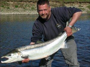 Ghillie Steven McIrvine holding the fish