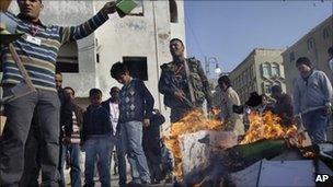 Libyans burn copies of the Green Book in Benghazi on 2/4/11