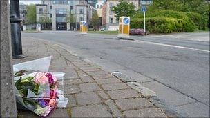 Flowers laid at the scene of the death of cyclist at the entrance to the North Beach Car Park