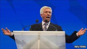 Gilles Duceppe speaking at a podium