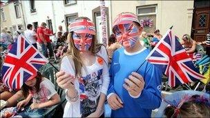 Jemma Denners, 14, and Jay Roger, 11, with union jack face paint and flags at a street party in Fleet Street, Sandfields, Swansea