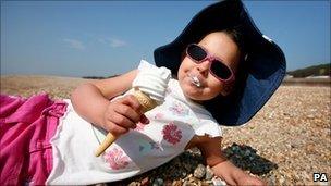 Girl eating icecream during warm April weather