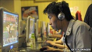 A man plays online games in Beijing