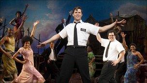 Andrew Rannells (centre) performs in The Book of Mormon