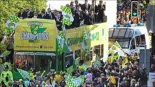 Bus carrying Norwich City players through Norwich city centre