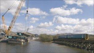 Train passing near the construction of the Porthmadog bypass