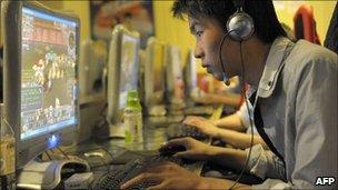 A Chinese man plays online games at an internet cafe in Beijing (file photo)