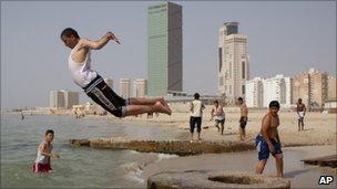 Libyans enjoy a day on a beach in Tripoli, Libya, Tuesday 3 May 2011