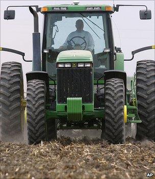 A tractor planting a corn field (Image: AP)