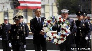 The US president carries a wreath during a ceremony at Ground Zero, in New York (5 May 2011)