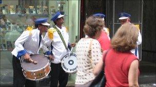 Band playing outside mobile phone shop in Sao Paulo city centre