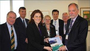 Transport Minister Theresa Villiers is presented with the rail action plan for Kent