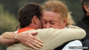 Spanish golfers Jose Maria Olazabal and Miguel Angel Jimenez console each other at the Spanish Open in Barcelona on 7/5/11