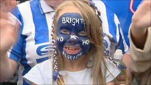 A young girl celebrates Brighton's success