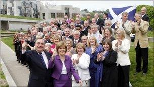 SNP leader Alex Salmond and SNP deputy leader Nicola Sturgeon with newly elected SNP MSPs outside Scottish Parliament in Edinburgh