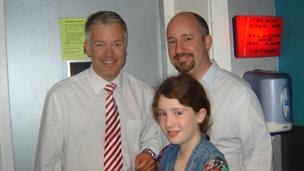 Derek Brockway with Erin and Mark Moran