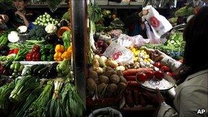 Woman buying food from a stall in Beijing