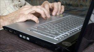 man on computer