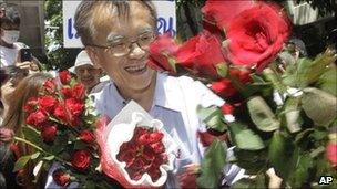 Somsak Jeamteerasaku, a Thammasat University historian, outside police station, May 11, 2011