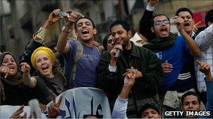 Anti-government protesters chant and sing in Tahrir Square January 30, 2011 in Cairo