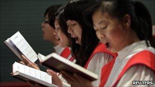 Members of the Shouwang Church choir sing hymns during a Sunday service in Beijing (file photo)