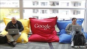 Men using laptops on Google bean bags