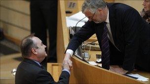 Alex Salmond shakes hands with outgoing presiding officer Alex Fergusson