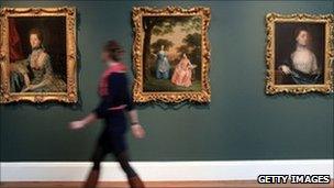 Woman walking past paintings at Holburne Museum