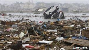 Damaged cars in Watari, Miyagi prefecture, on 22 April 2011