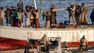 Anti-piracy force boards a hijacked dhow (photo courtesy EU NAVFOR