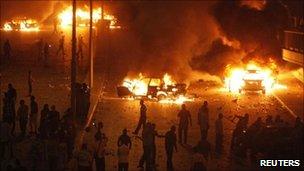 Cars burning outside Egypt's state TV building in central Cairo - 15 May 2011