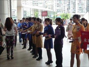 Girls representing casinos greet people at the Chinese border crossing