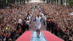 Olympic gold medallist Steve Redgrave carried the Olympic torch along the Mall before the Beijing Olympics