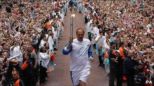 Sir Steve Redgrave with the Olympic torch