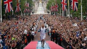 Steve Redgrave carrying the Olympic torch through London