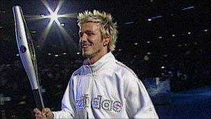 David Beckham with the Queen's baton