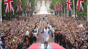 Sir Steve Redgrave carrying the Olympic torch in London (Photo: PA)